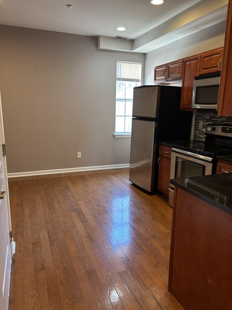 Kitchen and first living room - 4-Bed 2-Bath Apartment Available NOW to July 2026