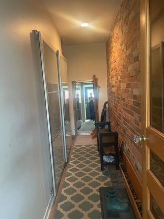 Entrance to foyer and laundry. - Furnished bedroom in house in Riverdale.
