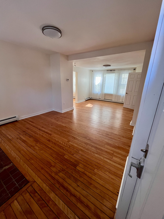 Large living space as you enter - 3 BR Apt, totally renovated house, close to campus, hospital & downtown