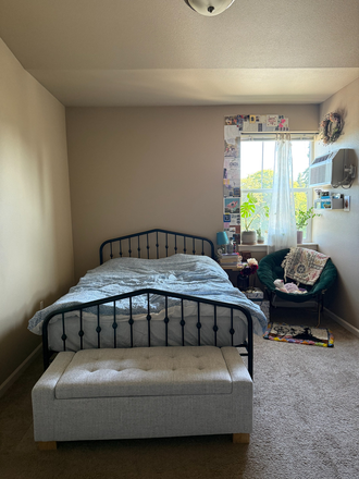 My (your) bedroom perspective from the door. The bed, chair, and ottoman are included. - 950 Alder Apartments