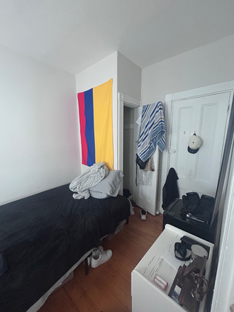 Picture of the bedroom, its secondary entrance, and its closet. - Room near campus Apartments