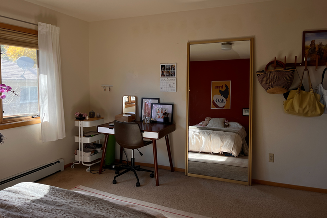 Another photo of bedroom with large mirror, desk, and coat rack. - Room for Rent in 4 Bed House on the Hill