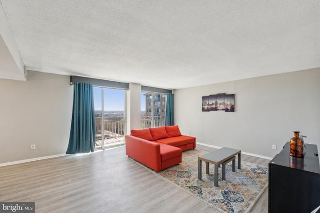 Living Room - Looking for roommate 2 bed 2 bath condo close to campus