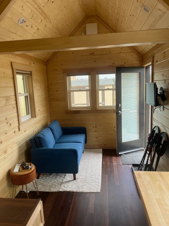couch and TV area - Studio for rent and trade ranch chores to reduce rent! Apartments