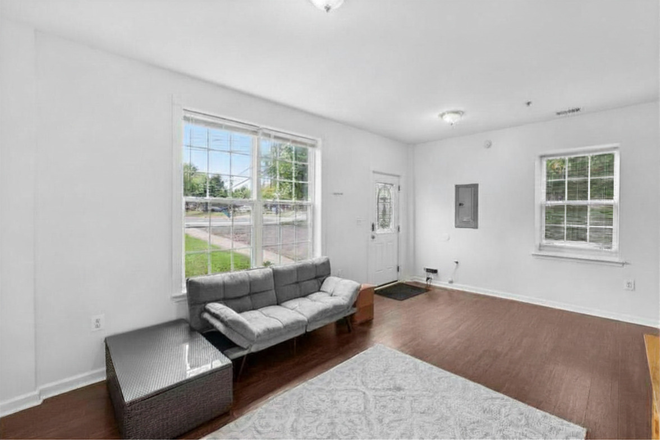 Living room - 4BR/1BA Converted Firehouse Near UMD – Free Driveway Parking & Metro Access