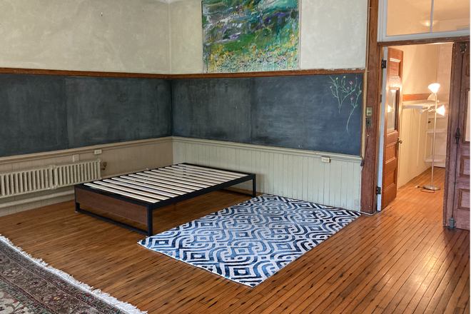 bedroom area - Restored Historic schoolhouse loft apartment