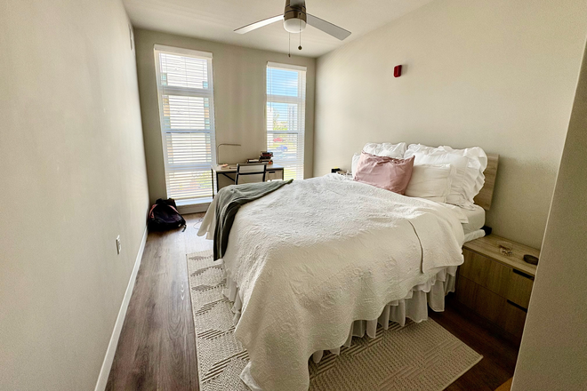 Bedroom with desk. Not pictured is attached bathroom and walk-in-closet. - The 87 Main Building