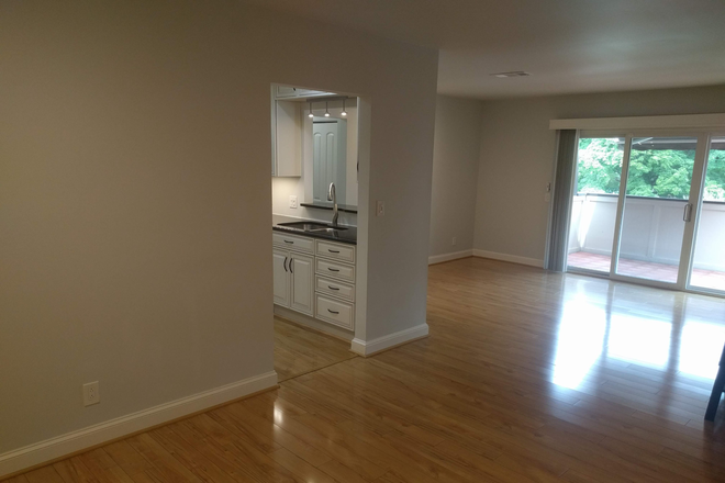 Dining room looking toward living room and sundeck - *** Move In Special *** 2bdrm/2bthrm Harwood Community Short Walk to Emory, CDC, Emory Hospitals Condo