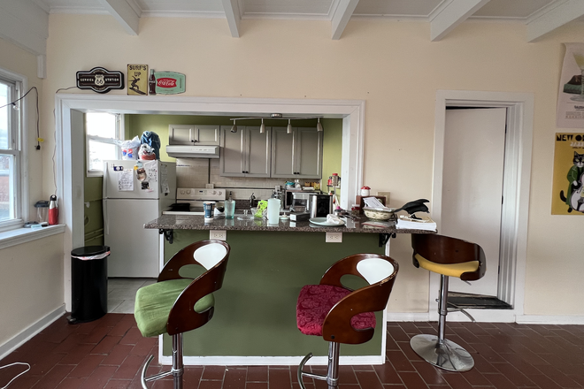 Granite-counter bar with kitchen open to living room - 1105 W. Franklin - Apt #6 Penthouse- Colonial charm with modern amenities