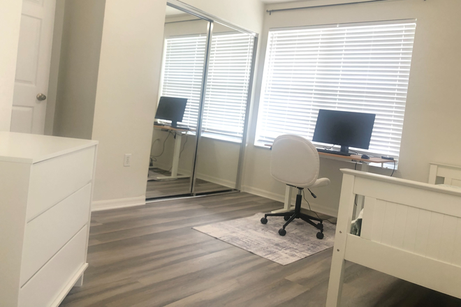 Closet with sliding mirror door - Kensington North Condo