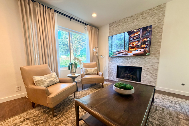 Comfortable sofa seating with warm, inviting decor for unwinding. - Student/Staff- Fully Furnished 3BR Townhome Near Chapman University w/ Utilities and Parking
