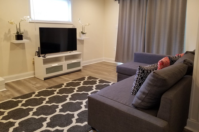 Lower living room - Fully furnished bedroom in College Park Woods House