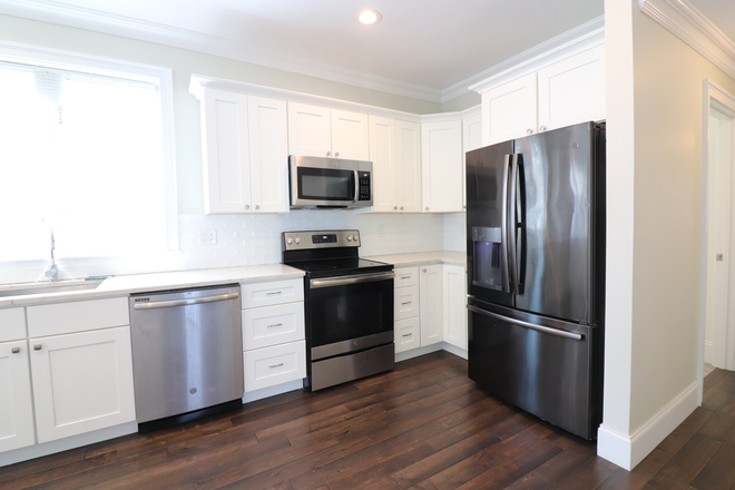 kitchen - Modern JP 4 bed/2 bath with in unit laundry, AC, and a deck - NO FEE! Apartments