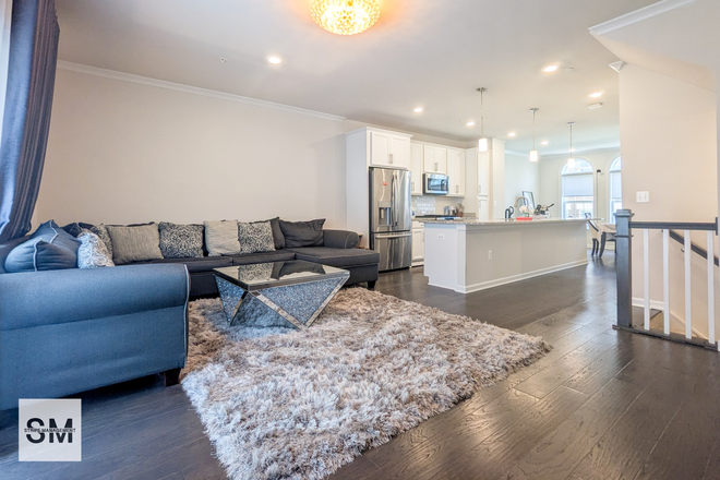 Living Room - PREMIUM STUDENT HOUSING ACROSS FROM UNIVERSITY OF MARYLAND W/ ALL UTILITIES INCLUDED–NOW LEASING! Townhome