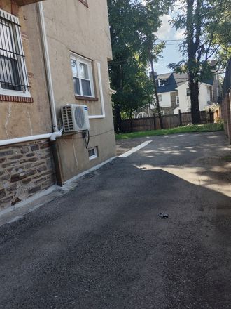 Drive way behind this building to get to private parking. - Comfort Residential Duplex