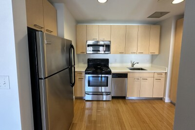 living - STUNNING 1 BED WITH HOT WATER INCLUDED, NO BROKER FEE! 9/1/26!!