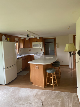 Living room to kitchen view - 690 South Windsor St. Apartments