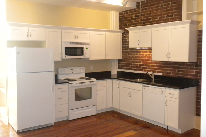 Granite kitchen - Avail July 1, 2025 Electric (general, heat & hot water included) in this gorgeous apt. brick walls!