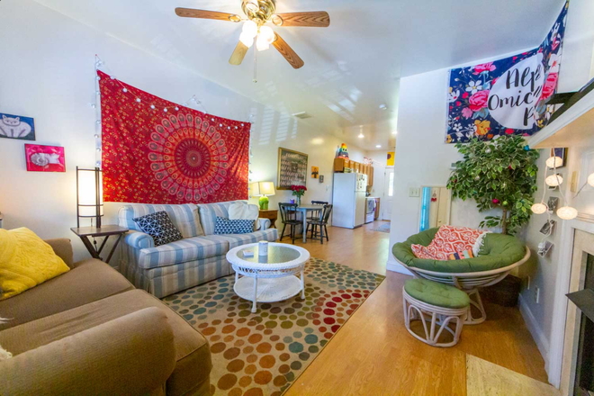 Living room (not our furniture, but the same floor plan). - Room for rent at Ridgeview Townhomes