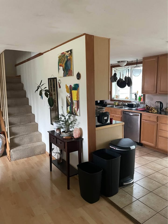 kitchen and stairs to room - Room in a house near Amazon park