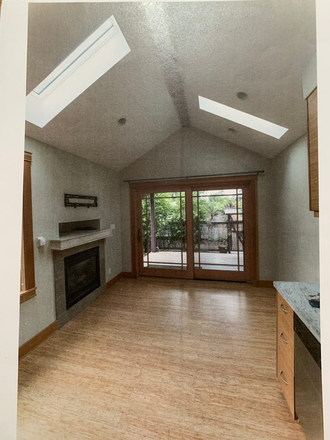 Front living area with fireplace and door to deck. - PRIVATE COSY BERKELEY RETREAT Apartments