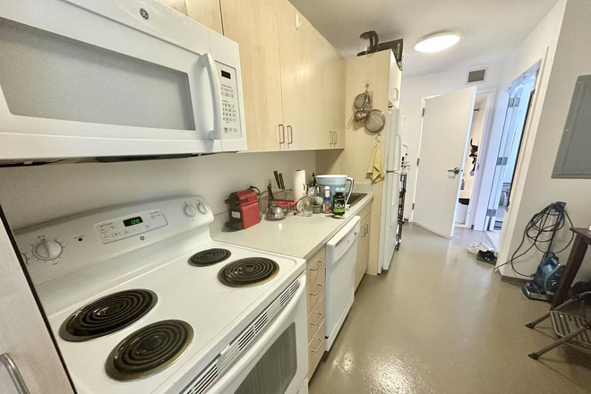 kitchen - Top-Floor Apartment with Floor-to-Ceiling Windows and Central AC