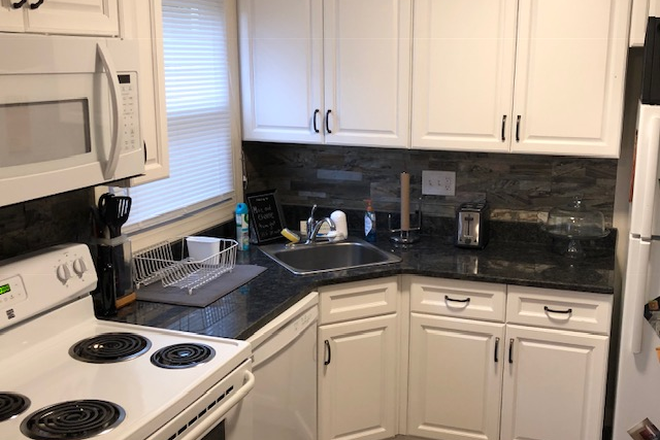 Granite kitchen - Renovated townhomes Avail 7/1/26 4 Bed, 1.5 Bath, 2 free parking, laundry in each unit, yard