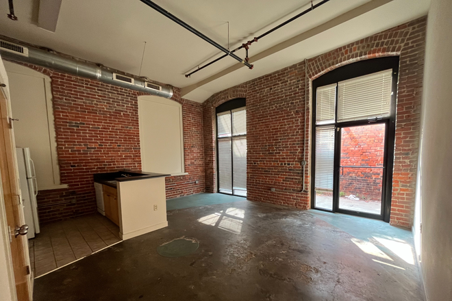 #132 - living room area leading to patio - Need Housing Last Minute? Studio to 3 Bedrooms Available!