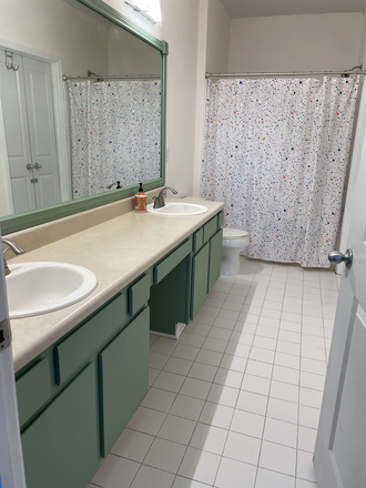 Private en-suite bathroom - Furnished primary suite in a vibrant condo with direct beltline access