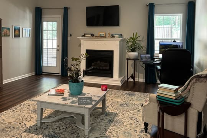 Living room. I've since added a leather couch and loveseat. - Peaceful, Spacious Knoxville-themed Room in Gorgeous 2 Bedroom Condo