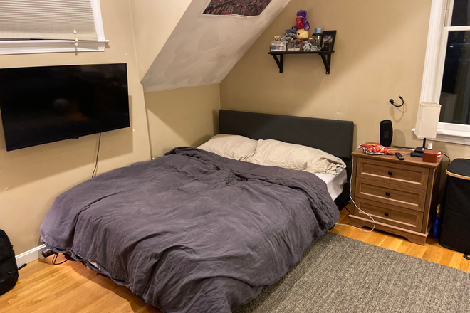 Queen Bed, Bedside table - Sublease! In unit laundry! Less than 10 min. from BU campus, Spacious bedroom with connected bath Duplex