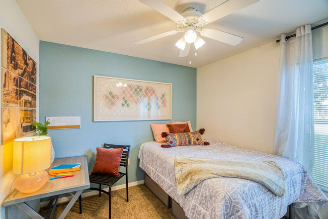 bedroom with desk, dresser and bed - Northgate Lakes Apartments Available now until July 31 3 bedroom 3 bathrooms