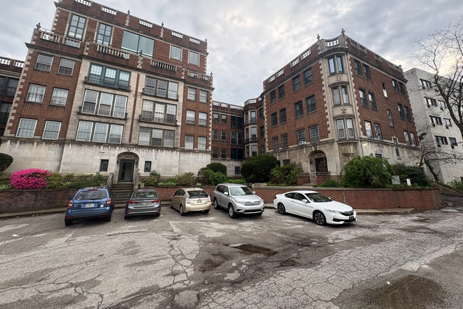 View from outside. The apartment is on the first floor of the section of the building to the right side in this image. - Cedar Glen Apartments