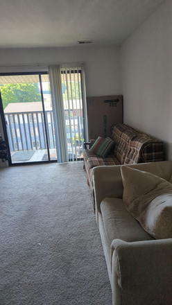 Living room and balcony - 2 rooms available in a 3BHK apt at Foxridge Apts