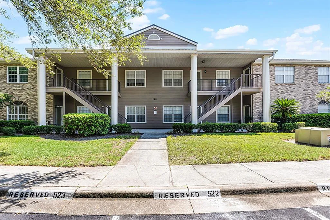 Outdoor view of Building - Furnished Room with Bathroom in a 2 br. Condo.  2 minutes from UCF Beginning January 2026