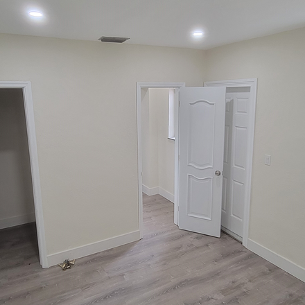 Large Bedroom with several windows overseeing backyard - relaxing setting - New efficiency near UM & Metro w/Large Bedroom/Private Bathroom & Kitchen - (Utilities in House