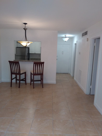 Living room looking toward front entrance - Best Location Between Grove/Gables, JMH/UM, Rosenstiel/NOAA Condo