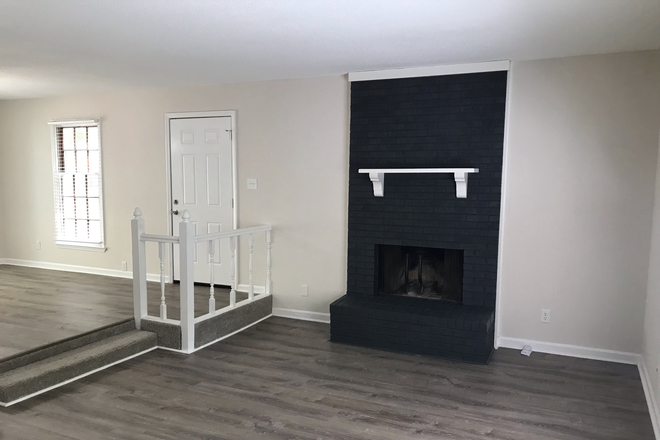Living room off kitchen - Crabtree Woods Townhome West Raleigh