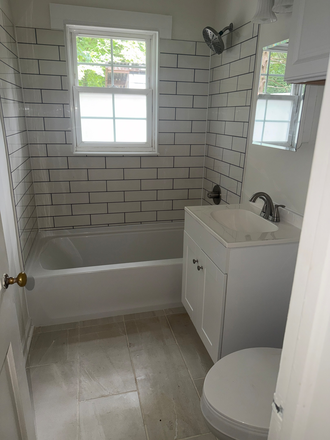 Bathroom - Newly Renovated 2BR/1BA Near UNC - Hardwoods & In-Unit Laundry Duplex