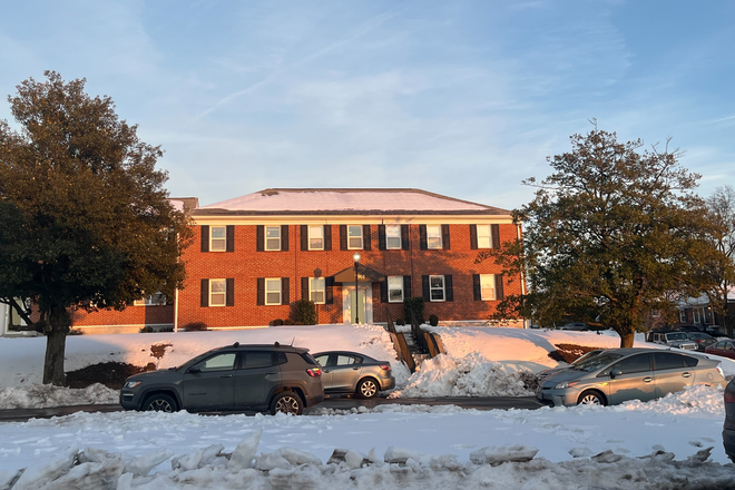 Front view of apartment building during winter - Donnybrook Apartments
