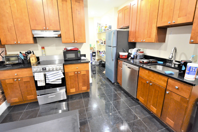 Kitchen/dining space /spacious pantry/ there is also access to the stairwell down to the alley/trash via a door in the pantry. - Private Room in 4BR/2BA at 103 Hemenway – Steps from Campus!