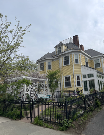 The apartment entry is through the white sunroom on the right. - Brand New, Light-Filled, Furnished 2BR, 1.5BA with Parking, Charger, W/D, In Brookline Victorian