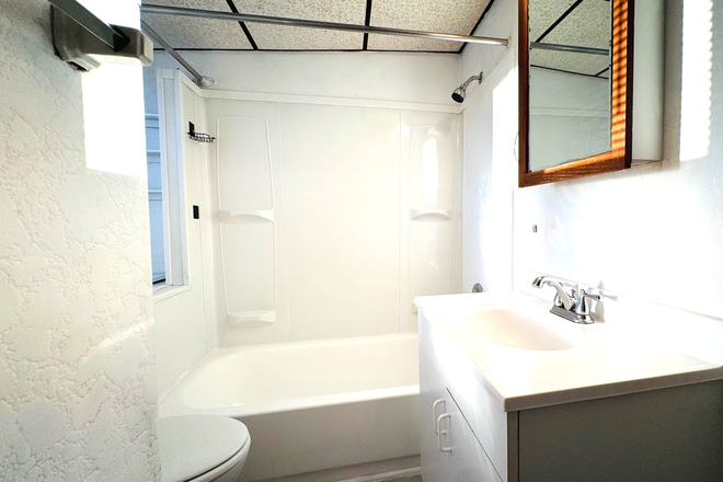 Clean bath room with tub newly refinished. - Fully Furnished Private Room with Utilities High Speed Wifi Apartments