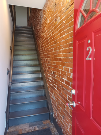 Front Door and staircase. - Grove Townhouse Apartment