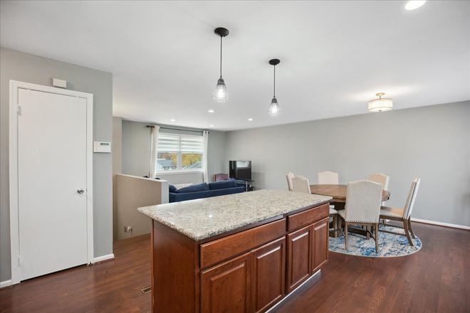 Kitchen island - Stunning 4-Bedroom Home with Modern Comforts