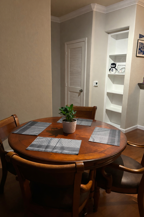 Dining area open to kitchen and living space with built-in bookcase. - Fully Furnished 2 Bed/2 Bath Condo, Includes All Utilities and Fees