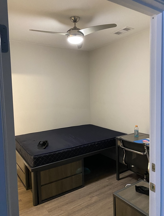 Bed, two dressers, desk, chair, and bookshelf are included with the room - Colab Apartments