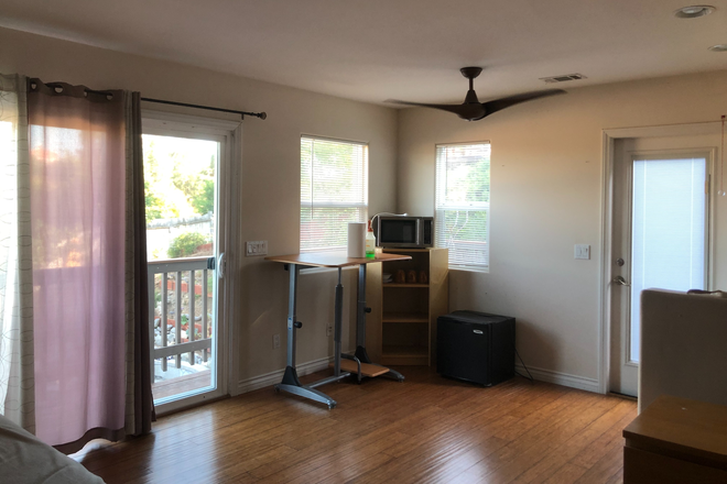 Work Area with adjustable desk - Studio Clairemont Apartments