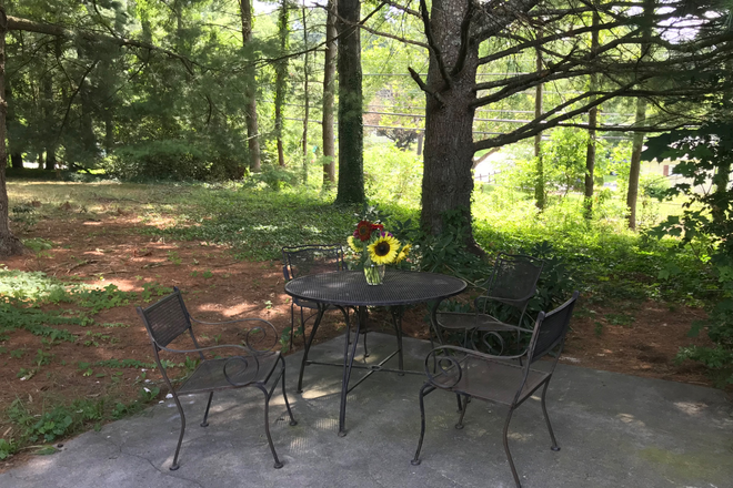 Back patio with patio table and chairs - Bedroom with private bathroom available ***January 1, 2026 House