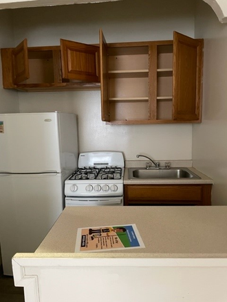 Kitchen - Academic Properties Inc Apartments